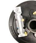 Close-up of Southwest Wheel 3,500 lb trailer axle electric brake kit with 5-4.5 in bolt circle, black hub.