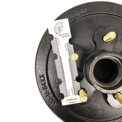 Close-up of Southwest Wheel 3,500 lb trailer axle electric brake kit with 5-4.5 in bolt circle, black hub.