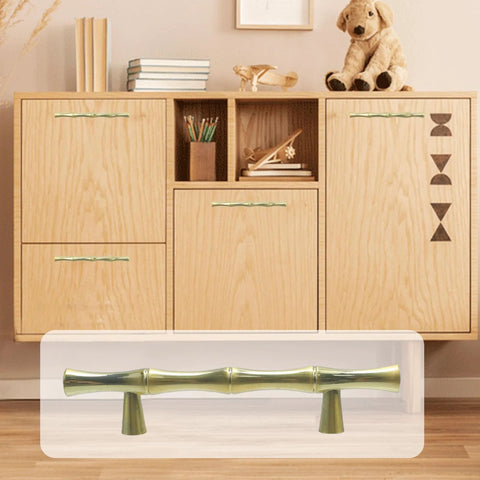 Bamboo Shape Zinc Alloy Drawer Pulls in Brushed Gold Finish 4.96 inch length displayed on a wooden cabinet, shown with 3 inch center to center hole distance.