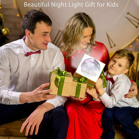 Family giving Moon Galaxy Lamp Night Light For Kids With 16 Colors 3D LED Moon as Christmas gift with child holding box.