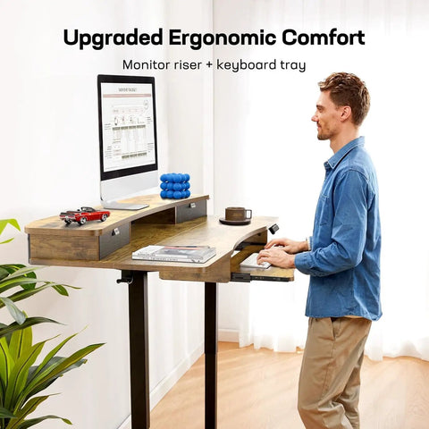 Huanuo Electric Standing Desk 55 Inch With 2 Drawers And Keyboard Tray Vintage Finish in use with computer monitor and ergonomic setup.