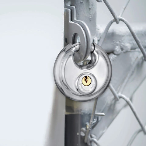 Stainless Steel Discus Padlock With Three Eighths Inch Hardened Shackle For Sheds, Garages, Fences And Storage Units installed on gate