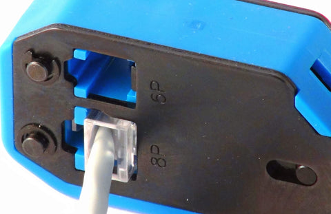 Close-up of Pro Grade Multi Function Data And Voice Crimp Tool Kit for CAT3 CAT5e CAT6 cables, demonstrating cable insertion.