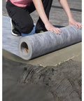 Heavy Duty Polyethylene Decoupling Membrane For Walls And Floors Delivers Rock Solid Waterproof Protection being laid down.