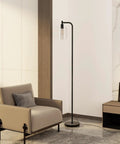Modern Black Floor Lamp With Seeded Glass Shade Dope Bright LED Bulbs Industrial Tall Pole Standing Lamp For Living Room Bedroom Or Office Sleek Yet Sturdy Lighting That Fits Any Decor, placed beside a beige armchair in a modern living room.