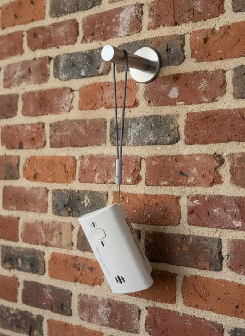 No Drill Wall Mount For Carbon Monoxide Alarms Battery Back Cover Included Upgrade With Lanyard Portable Design And Quick Release Bracket So Easy To Install No Drilling Alarms Not Included installed on brick wall