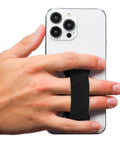 Hand holding smartphone with Premium Silicone Phone Strap Grip With Magnetic Mount And Kickstand For Smartphones And Tablets One Handed Texting And Selfies Waterproof And Easy To Clean Black On Black Base