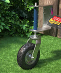 Heavy Duty 8 Inch Gate Wheel For Wooden Or Metal Gates With Pneumatic Tire Spring Loaded 360 Degree Rotation 400 Lb Capacity Includes Screws And Spanner For Smooth Sliding And Stable Gate Positioning installed on a wooden gate.