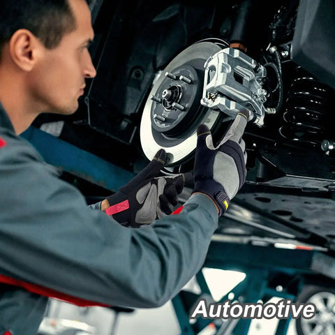 Mechanic wearing Mens Work Gloves KG125M repairing vehicle brake system, showcasing heavy duty build and ultra grip.
