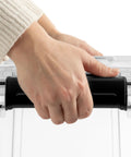 Hand gripping the lid of Built Like A Tank 34 Quart Gasket Storage Boxes With Lids, showcasing heavy duty plastic design.
