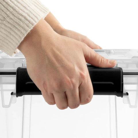 Hand gripping the lid of Built Like A Tank 34 Quart Gasket Storage Boxes With Lids, showcasing heavy duty plastic design.