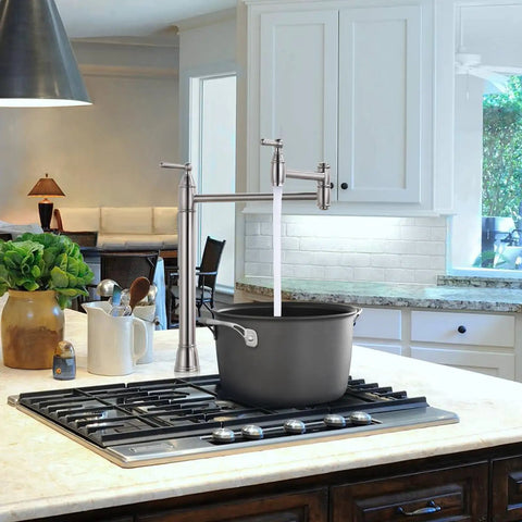 Pot Filler Deck Mount Kitchen Faucet In Brushed Nickel, Folding 2-Handle Design over stove filling black pot.