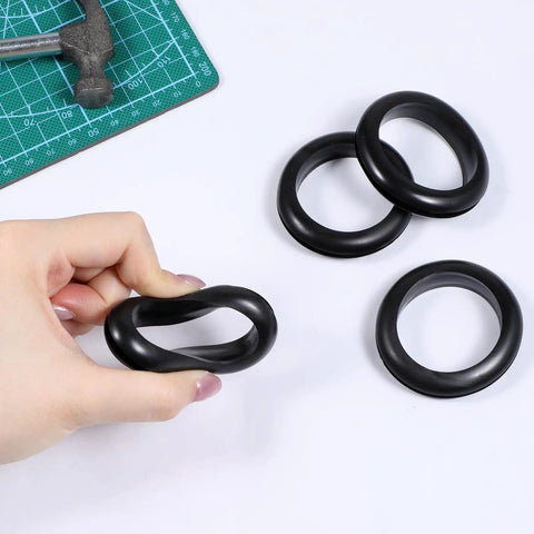 2 Inch Rubber Grommet Kit, 4 Pack Large Wire Hole Plugs shown with hand and cutting mat for size reference