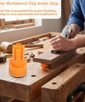 Heavy Duty Three Quarter Inch Aluminum Workbench Dogs Eight Pack With Grippy Pads For Killer Grip; orange peg brake stop in use on wooden workbench.
