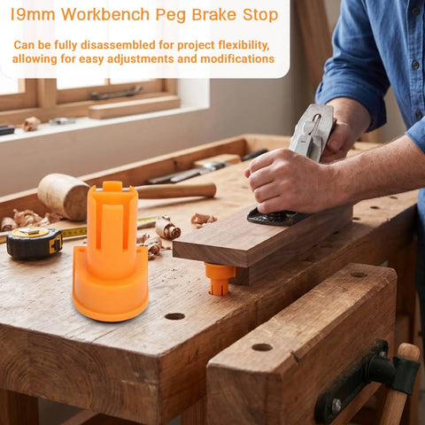 Heavy Duty Three Quarter Inch Aluminum Workbench Dogs Eight Pack With Grippy Pads For Killer Grip; orange peg brake stop in use on wooden workbench.