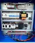 Heavy Duty Programmable Electric Hydraulic Tube And Pipe Bender Featuring Programmable Logic Controller Seven Horsepower Motor Includes circuitry panel with wiring and components.