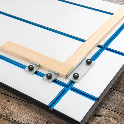 Intersections Kit for T Track Systems, showing dual T track intersections with predrilled mounting holes on a wooden workbench surface.