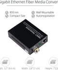 BiDi Gigabit Single-Mode Fiber Ethernet Media Converter Kit With Two SFP LC Transceivers Included, 10 100 1000BaseT To 1000Base SX SMF Up To 30 Kilometers, 1.25 Gbps 1310 Nm Ports, AC DC Power Supply Included, black compact media converter with dimensions and features listed.