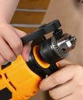 Person using 3 In 1 Magnetic Ratchet Drill Chuck Key Wrench With Quick Switch Reversible Ratchet And Non Slip Grip on yellow drill.