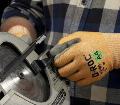 DX Technology Cut Resistant Work Glove With Polyurethane Palm ANSI A4 Protection handling a power tool, showing grip and protection.