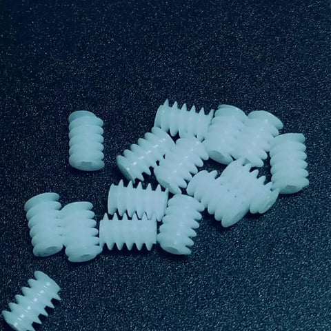 10 Pack 0.3 Module Plastic Mini Worm Gears Kit, 0.65mm Inner Hole, 3.5 by 5mm size on a dark surface