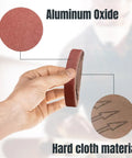 Hand holding Three Eighths Inch By Thirteen Inch Sanding Belts Ten Pack 150 Grit Aluminum Oxide Belts for metal polishing