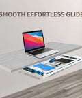 Under Desk Sliding Drawer With Smooth Ball Bearing Rails For Sit Stand Tabletops showing white organizer under desk with laptop and office supplies.