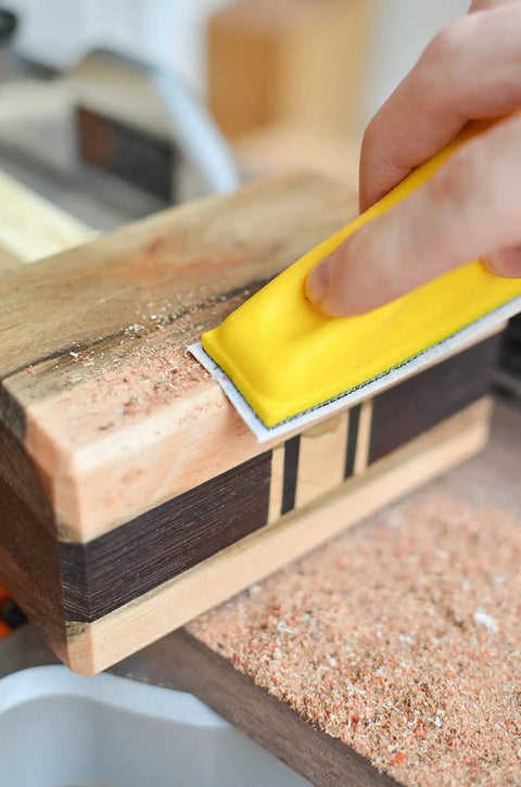 Using MicroZip Sander Kit with Assorted Grit Sanding Sheets for 3.5 Inch by 1 Inch Hook and Loop Pad on wooden surface.