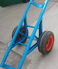 Tough As Nails Heavy Duty Pole Hauler Cart For Concrete Utility Lines And Long Material Transport With Swivel Casters And Bulletproof Steel Chassis Assembly, side view with blue frame and red wheels.