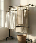 Freestanding garment rack made with 0.5 Inch Black Malleable Iron Pipe Nipples 30 Inch Long Pack Of 10 Threads Both Ends For DIY Projects Industrial Steampunk Home Decor And Vintage Style.