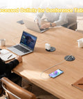 Three Inch Desktop Power Grommet With 35W USB C Fast Charging And Dual 18W USB A Outlets Black Six Foot Cord at a conference table setup.