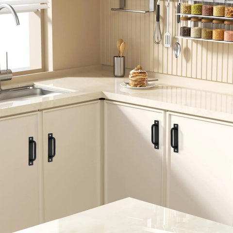 Black Barn Door Handle Set Two Pack Aluminum Alloy Punch Free Sliding Handles installed on white kitchen cabinets.
