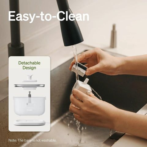 Hands cleaning wireless pump of No Fuss Cat Water Fountain With Stainless Steel Tray, Wireless Pump, Dual Flow Water Streams, 2.5L Automatic Pet Water Dispenser That Is Easy To Clean And Helps Cats Stay Hydrated.
