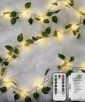 Vine With Fairy Lights Battery Operated 33Ft 100 LED Pothos String Lights With Remote Warm White Leaves On Soft White Background
