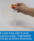 Straight Up Legit Copper Test Kit For Aquariums Using 90 Quick Liquid Drops filling a test tube with aquarium water.