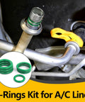 Close-up of 485 Piece Metric AC O Ring Kit For Automotive HVAC Systems showing green O-rings on AC lines and fittings.