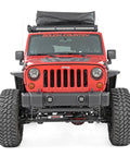Front view of Jeep Wrangler JK 2007-2018 with Front Bumper Caps For Jeep Wrangler JK 2007 2018 Rock Crawler Stubby Conversion Nylon Caps Improve Approach Angles Eliminate Eleven Point Five Inches Per Side Easy Install With Lifetime Replacement installed.