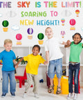 Children in classroom with 3D Hot Air Balloon Honeycomb Bulletin Board Set for Classroom Decor with Colorful Balloon Cutouts and Cloud Shapes