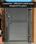 Heavy Duty Gate Lock Kit Featuring Keyless Mortise Latch And Brush Finish For Metal Gates, gray coded lock on a sturdy gate.