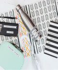 Compact Portable Label Maker Bundle Featuring Qwerty Keyboard Preview Display With Four Laminated Tape Rolls For Quick Home Office Organization Runs Totally Smooth Straight Up A Sweet Deal For Daily Grind And Quick Touch Ups. Labeling various items including a water bottle and planner.