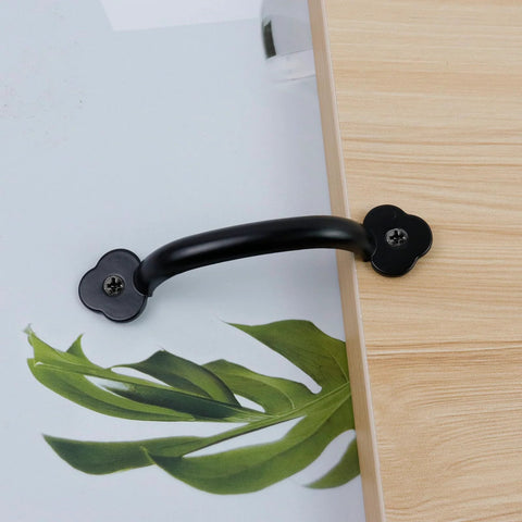 Zinc Alloy Modern Black Pull Handle For Wardrobe Cupboard And Drawer Furniture Hardware Pack Of 12 installed on wooden surface