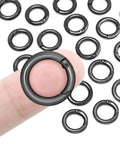 16 Pack Small Spring O Rings For Keychains And Dog Tags 11mm Inner Diameter 17.5mm Outer Diameter 3.7mm Thick on fingertip