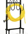 Heavy Duty Freestanding Garden Hose Holder With Four Prongs A Real Workhorse Metal Hose Reel Stand That Holds Up To 100 Feet Of Hose Great For Outdoor Yards And Lawns Black, showing a sturdy black frame with a coiled yellow hose.