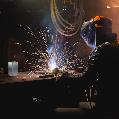 Person welding with sparks on workshop table, 32 Pack 6061 T6 Aluminum Welding Coupons Kit visible, for MIG TIG Stick MMA welding practice.