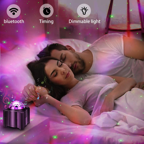 Couple sleeping under galaxy lights from 15 In 1 Star Projector With Remote, Galaxy Night Light And Moon Light, Bluetooth Speaker