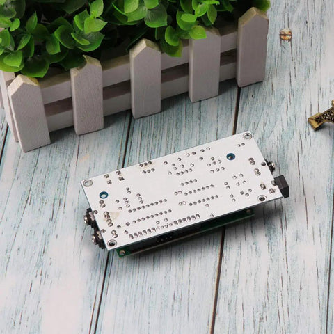 Back view of Ham Radio Essential CW Decoder Morse Code Reader And Translator With LCD Display No-Fuss Setup, outdoor setting.