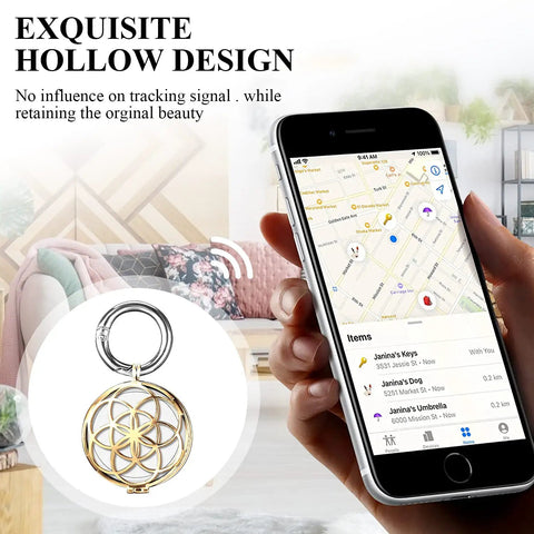 Gold Metal AirTag Protective Case And Key Ring Holder For Apple AirTag 2021 next to a smartphone showing tracker map