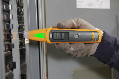 Person using 4 In 1 Breaker Finder, NCV Detector, Socket Tester And LED Flashlight on a circuit breaker panel