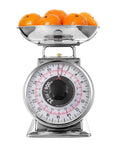 2 Pound Analog Food Scale With 32 Ounces Capacity Stainless Steel Mechanical Kitchen Scale Removable Bowl Tare Function holding oranges