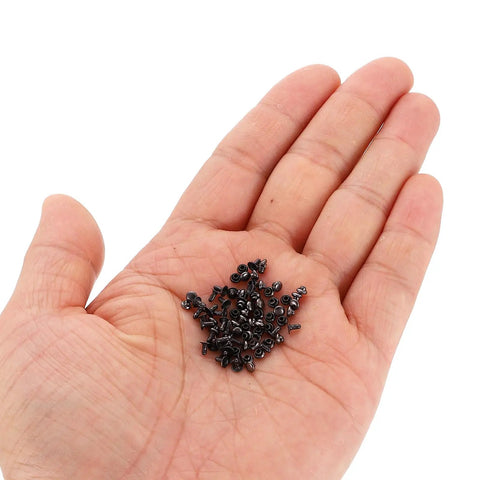 3mm Single Cap Rivets In Gunmetal Finish shown in hand, carbon steel fasteners for leather projects.